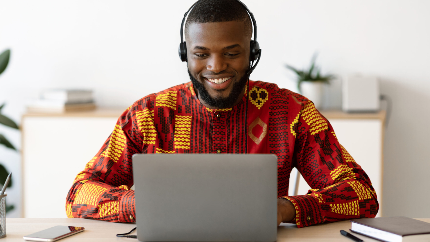 Distance,Education.,Smiling,Black,Man,In,African,Shirt,And,Headset